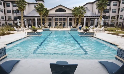 Relax and unwind poolside a swimming pool in a courtyard